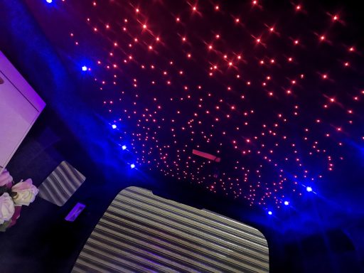 Starry ceiling featuring red and blue lights against a dark background.